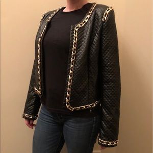 Black faux leather jacket with gold chain